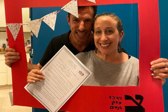 Happy couple shows off the CWJ halachic postnup they signed